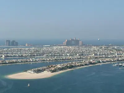 an aerial view of a beach with buildings and the water at 2BR-Beach Access - Stunning Marina&Palm View in Dubai