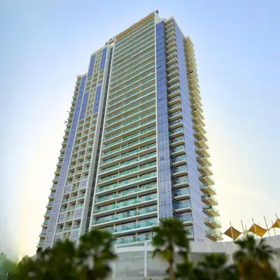 a tall building with a lot of windows at Damac Hills Carson A Monthly Stay - Pay 28, Stay 30 in Dubai