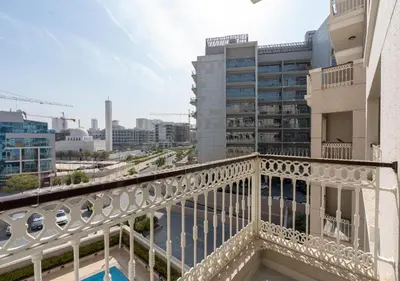 a balcony with a view of a city at Burj View - Luxury Studio - Near Dubai Miracle & Butterfly Garden- Arjan, Dubailand in Dubai
