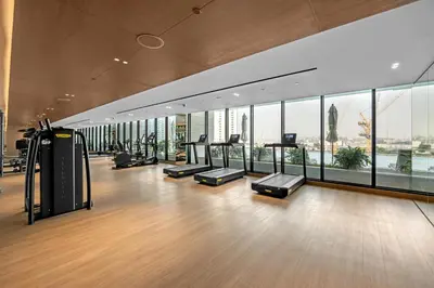 an empty gym with a view of the city at 1 Bedroom in Binghatti Lavender in Dubai
