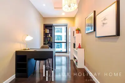a home office with a desk in a hallway at LUX The Al Seef Marina 4 bed Suite in Dubai