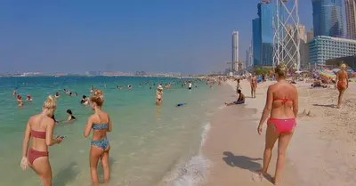 a group of people in the water at the beach at Single Bed In Twin Room With Balcony For Female Guests Only in Dubai