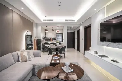 a living room with a couch and a table at QUARTZ Luxe 1-Bed at Nobles Tower, Near Downtown in Dubai
