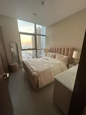 a bedroom with a large bed and a large window at Dubai Marina No 9 in Dubai