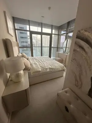 a bedroom with a bed and a large window at Dubai Marina No 9 in Dubai