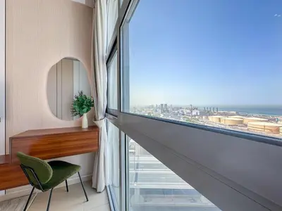 a room with a view of the ocean from a window at Upgrade Unit for 6 pax with Sea View Ideal Location Near Beach Big Balcony in Dubai