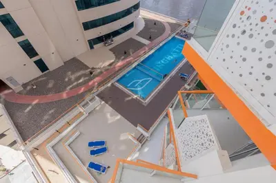 an overhead view of a swimming pool on a building at Luxurious apartment 8 mins from Burj Khalifa in Dubai