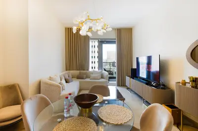a living room with a couch and a table at Stunning 1BR with Breathtaking Views Dubai Marina in Dubai