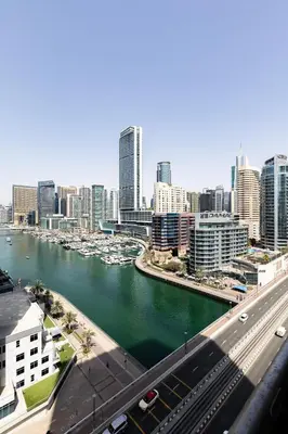 a view of a city with boats in the water at Stunning 1BR with Breathtaking Views Dubai Marina in Dubai