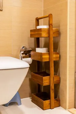 a bathroom with a wooden towel rack next to a toilet at Stunning 1BR with Breathtaking Views Dubai Marina in Dubai