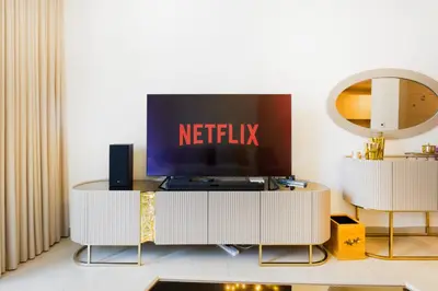 a living room with a tv on top of a table at Stunning 1BR with Breathtaking Views Dubai Marina in Dubai