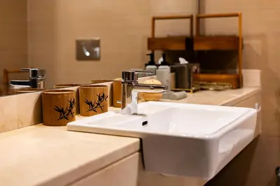a white sink in a bathroom with a counter at Stunning 1BR with Breathtaking Views Dubai Marina in Dubai