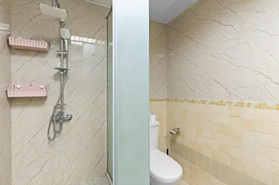 a bathroom with a shower with a toilet in it at 2-Bedroom Apartment Near To The Beach in Sadaf in Dubai