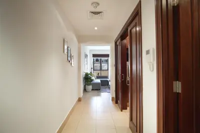 a hallway with a hallway leading to a living room at EasyGo- Spacious, Authentic, City Center in Dubai