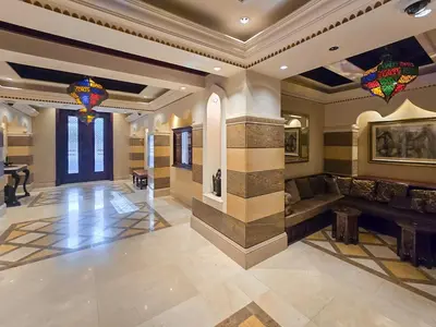 a large lobby with a couch and a table at EasyGo- Spacious, Authentic, City Center in Dubai