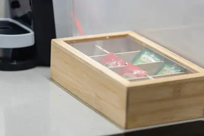 a wooden box filled with packets of toothpaste at Beachfront Bliss - Marina View - JBR The Address By ĀYA Boutique in Dubai