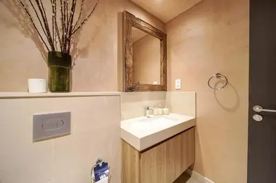 a bathroom with a sink and a mirror at PVH - Edgy and Modern Comfort 1BR Downtown Views 2 in Dubai