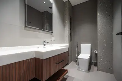 a bathroom with a sink and a toilet at High Floor With Marina View in Dubai