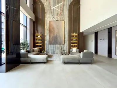 a lobby with couches and shelves in a building at Elegant and Cozy Studio Apartment - Amenities Access in Dubai