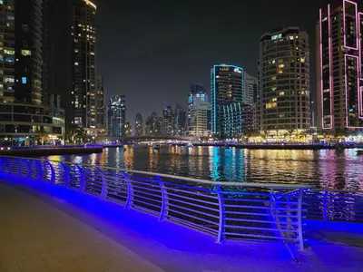 a view of a city skyline at night at Dubai Marina Amazing 1BR with Promenade view and Pool view --- Next to JBR beach---Opp JBR tram station in Dubai
