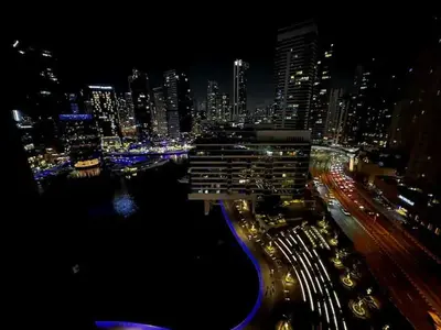 a view of a city at night with traffic at 3BR Marina view apartment in JBR Close to Tram & Metro in Dubai