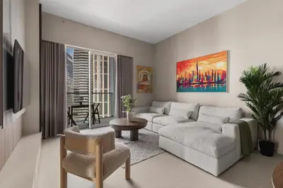 a living room with a couch and a table at Burj Khalifa View 2 BR Apartment w Parking in Dubai