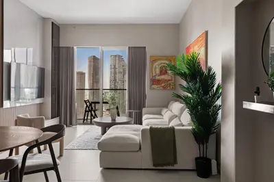a living room with a couch and a table at Burj Khalifa View 2 BR Apartment w Parking in Dubai