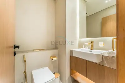 a bathroom with a sink and a toilet at Community Views 1BR Next to Mall and Park, Binghatti Amber, Jumeirah Village Circle by Deluxe Holiday Homes in Dubai