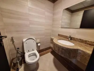a bathroom with a toilet and a sink at ARS vacation homes rental in Dubai
