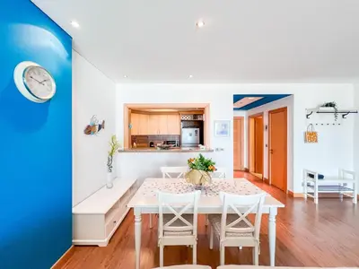 a kitchen and dining room with a white table and chairs at 1 BHK Palm Jumeirah Sea View Al Sultana Shoreline in Dubai