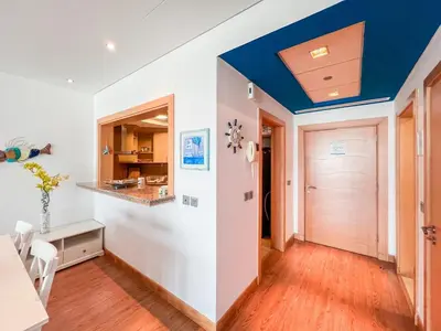 a living room with a blue ceiling at 1 BHK Palm Jumeirah Sea View Al Sultana Shoreline in Dubai