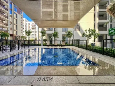 an outdoor swimming pool in a building with a canopy over it at GuestReady - Modern design in Dubai Creek Harbour in Dubai