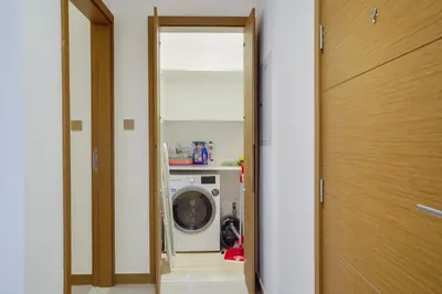 a door to a laundry room with a washing machine at 26- Apartment in Business Bay Dubai with Balcony & Pool in Dubai