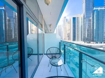 a view from the balcony of a building with a swimming pool at Luxury 2BR in Merano Tower & Stunning Canal Views in Dubai