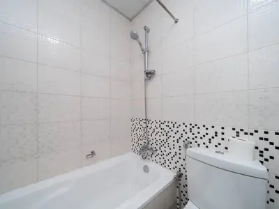 a bathroom with a tub and a toilet and a shower at Spacious 3 Bed Marina Haven with Waterfront Views in Dubai