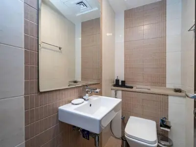 a bathroom with a sink and a toilet at Elegant 1-Bedroom Retreat with Marina Views in Dubai