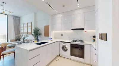 a kitchen with white cabinets and a dishwasher at PVH - Stylish 1BR in Binghatti House in Dubai