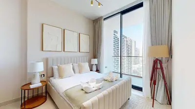 a bedroom with a large bed and a large window at PVH - Stylish 1BR in Binghatti House in Dubai