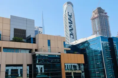 a view of a building with two tall buildings at Nivis find- Luxury & Spacious 1 BHK 10 mins away from Dubai mall in Dubai