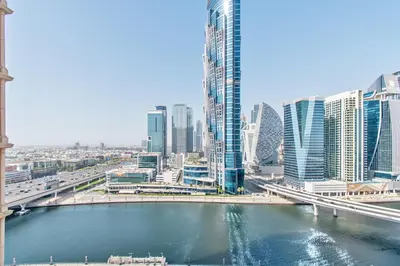 a view of a city with a river and buildings at DreamShoma-1BR Stunning Canal View in Dubai