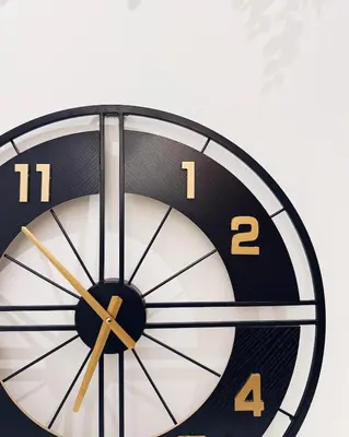 a black and white clock on a wall at Dubai Marina Modern 1 Bedroom Apartment - steps to tram & Marina Walk in Dubai
