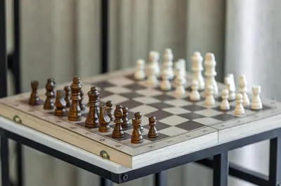 a chess set on a chessboard on a table at Mahogany 8 - 4BR 14PAX - Burj Khalifa View Central in Dubai