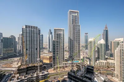 a city skyline with tall buildings in the foreground at Elegant Downtown Retreat in Dubai