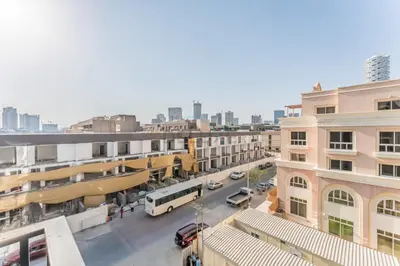 an overhead view of a city street with buildings at Brand New Building with Resort-style Amenities, Hamilton House, JVC By Deluxe Holiday Homes in Dubai