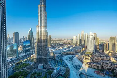 an aerial view of a city with a tall skyscraper at Grande Signature Residences Luxury 3BR - Burj View in Dubai Downtown in Dubai