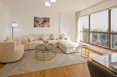 a living room with a couch and a table at Near Beach Luxurious 2-Bedroom in JBR in Dubai