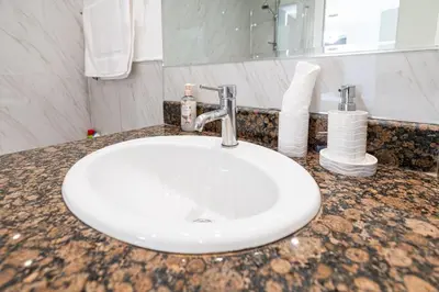 a bathroom counter with a sink and a mirror at Near Beach Luxurious 2-Bedroom in JBR in Dubai