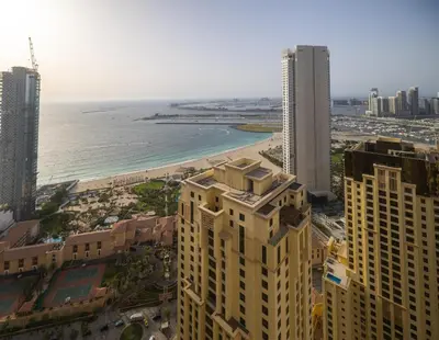 a view of a city with a beach and buildings at Near Beach Luxurious 2-Bedroom in JBR in Dubai