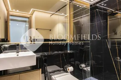 a bathroom with a sink and a mirror at Bloomfields Cozy 1Br In Binghatti Creek in Dubai