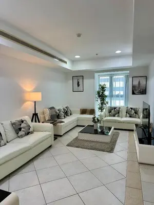 a large living room with couches and a table at Prime Marina Location Stylish Apartment in Princess Tower in Dubai